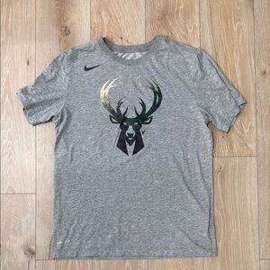 Nike Gray Short Sleeve Tee with Milwaukee Bucks front logo.